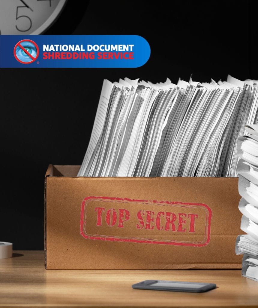 Box overflowing with personal documents ready to shred paper in bulk at home for secure disposal.