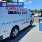 Secure Drop-Off Shredding Service bin at facility entrance for safe disposal of confidential documents and records.