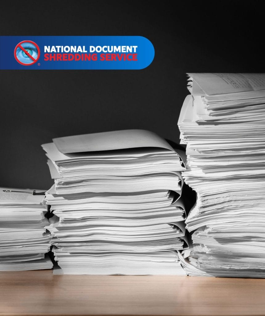 Customer using secure bin for document disposal as part of trusted shred services to protect personal and business information.